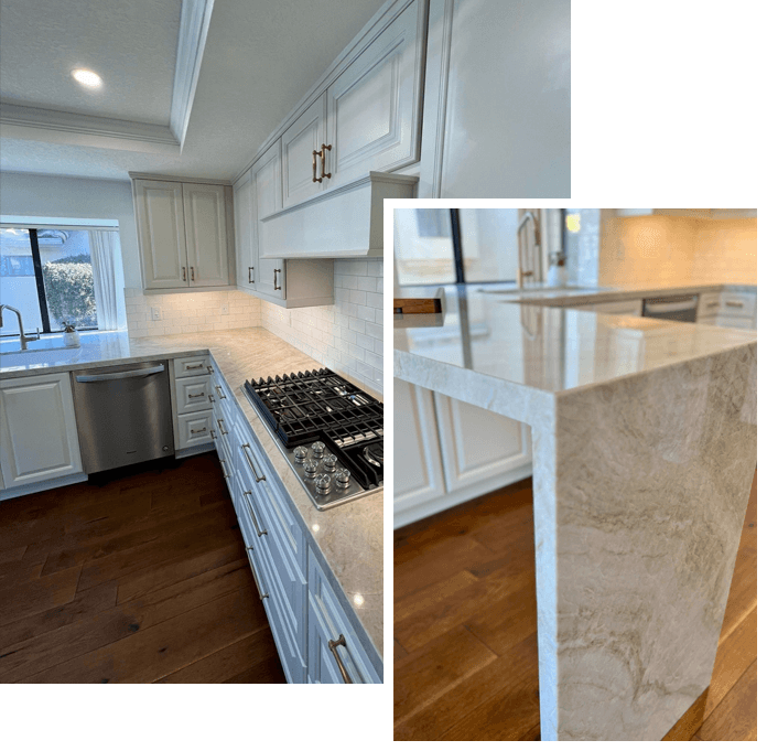 A kitchen with white cabinets and marble counter tops.