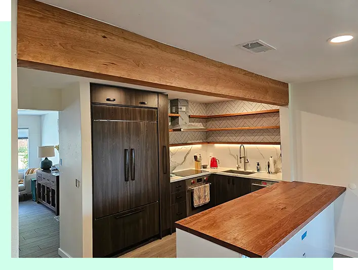 A kitchen with wooden counters and cabinets