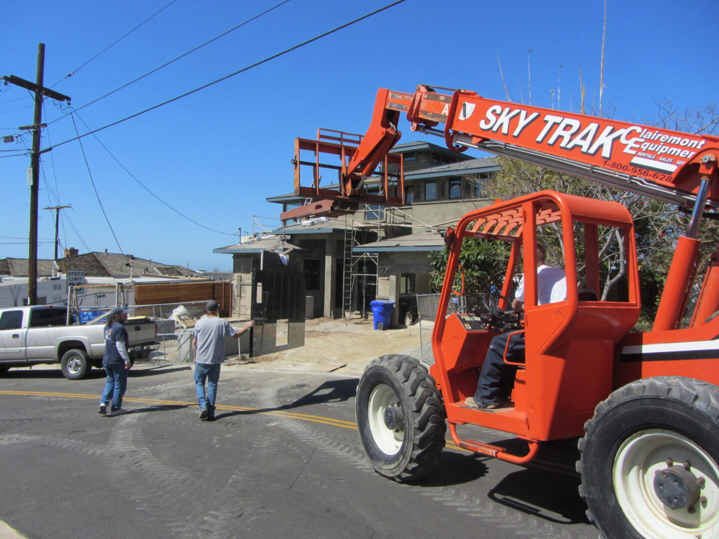 A crane is being used to lift a building.